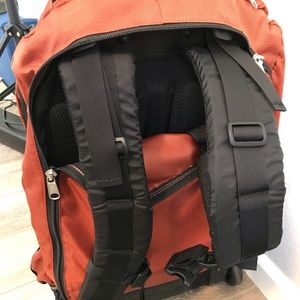 For the best backpackers. Orange backpack with wheels